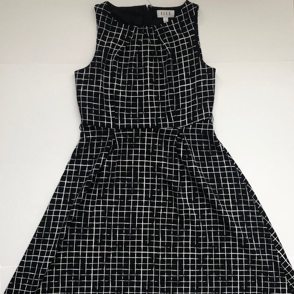 Black and white patterned dress. Flared at bottom